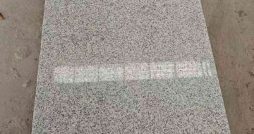 崇左芝麻白光面毛板