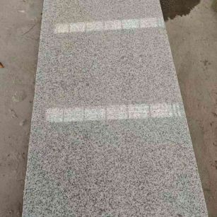 崇左芝麻白光面毛板